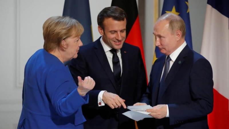 Ще се съберат ли пак скоро зедно Меркел, Макрон и Путин на среща на върха ЕС-Русия? Снимка: EFE